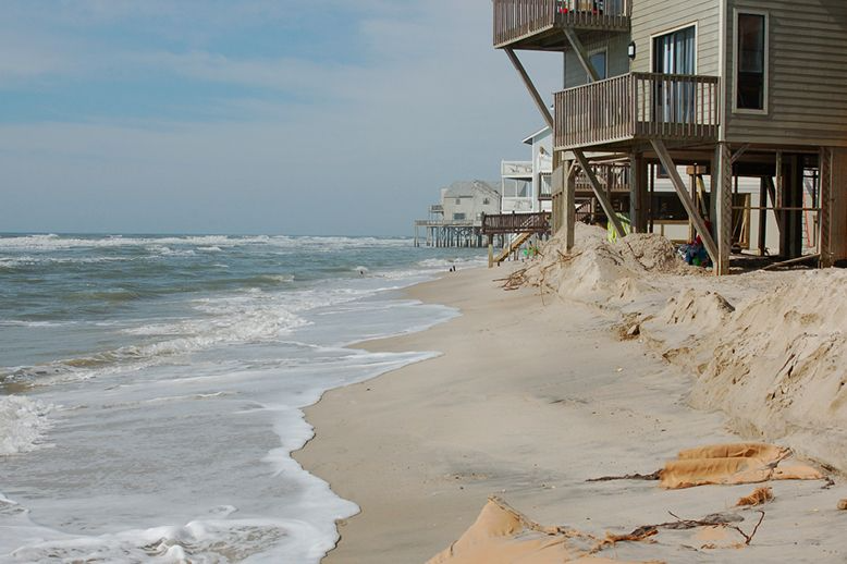 house-on-beach-with-waves-eroding-shore-in-page