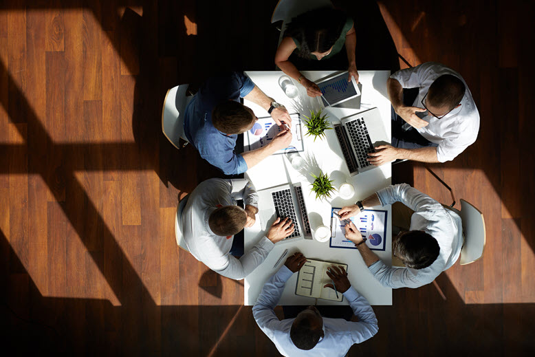 overhead-view-business-meeting-around-table