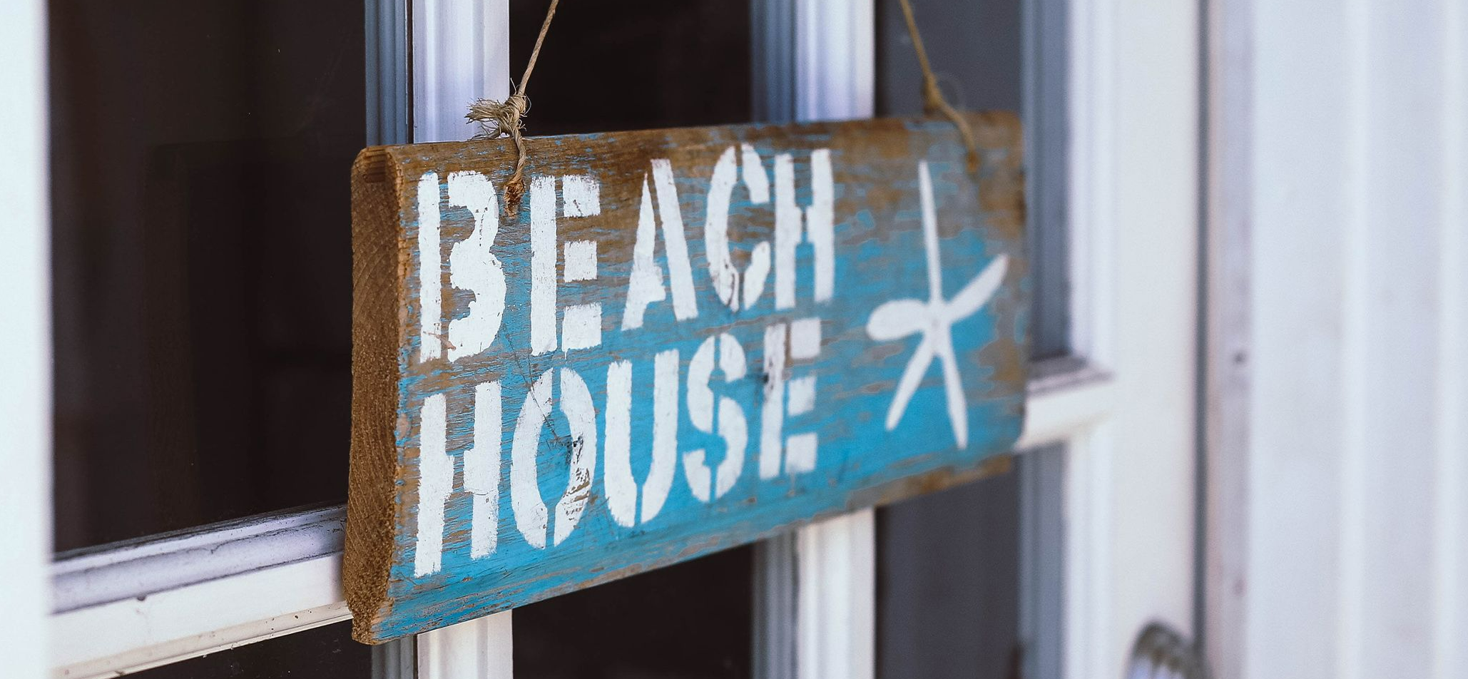 Beach House sign hanging on front door