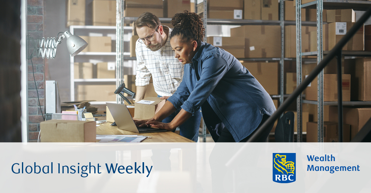 Two people processing orders for shipping