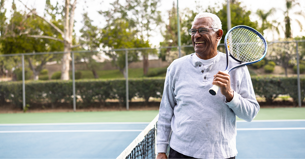 retired man playing tennis