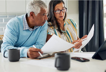Retired couple looking at paperwork