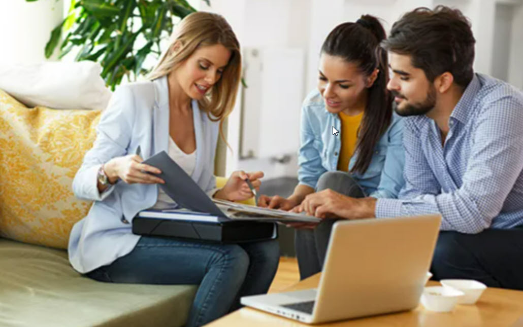 Young couple discussing finances with an advisor