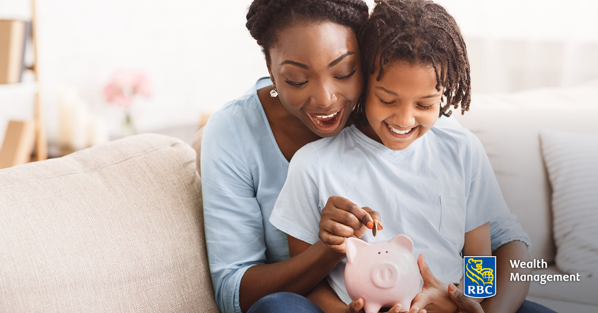 Child and parent with piggybank