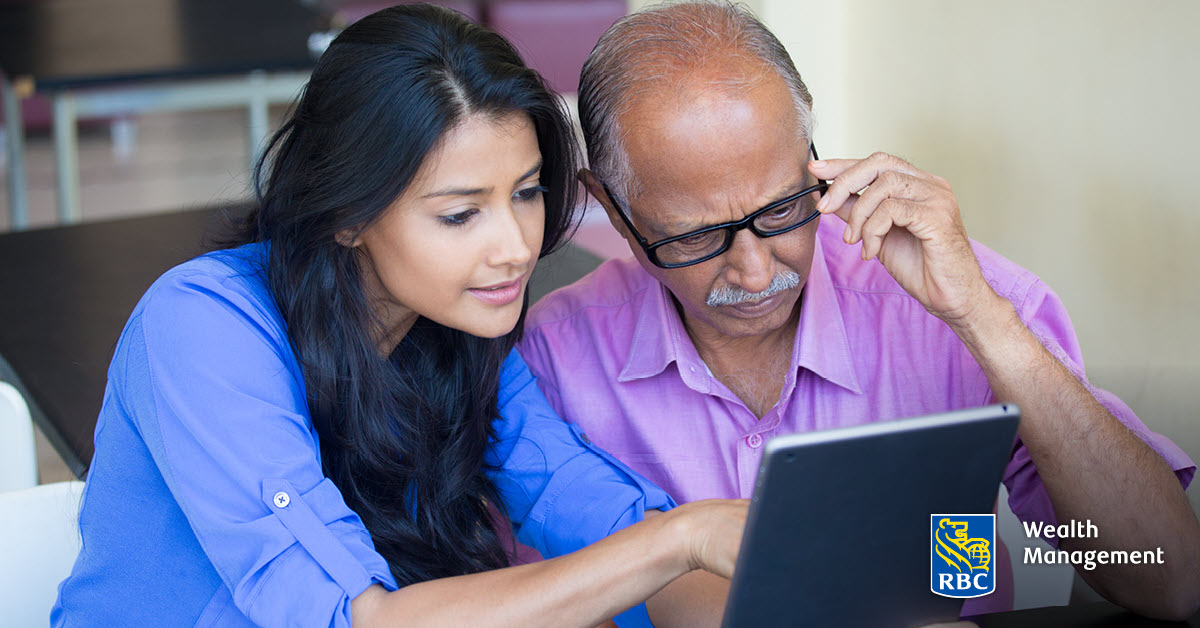 Daughter and father reviewing finances