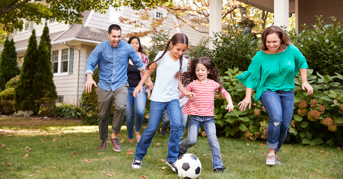 Family playing soccer
