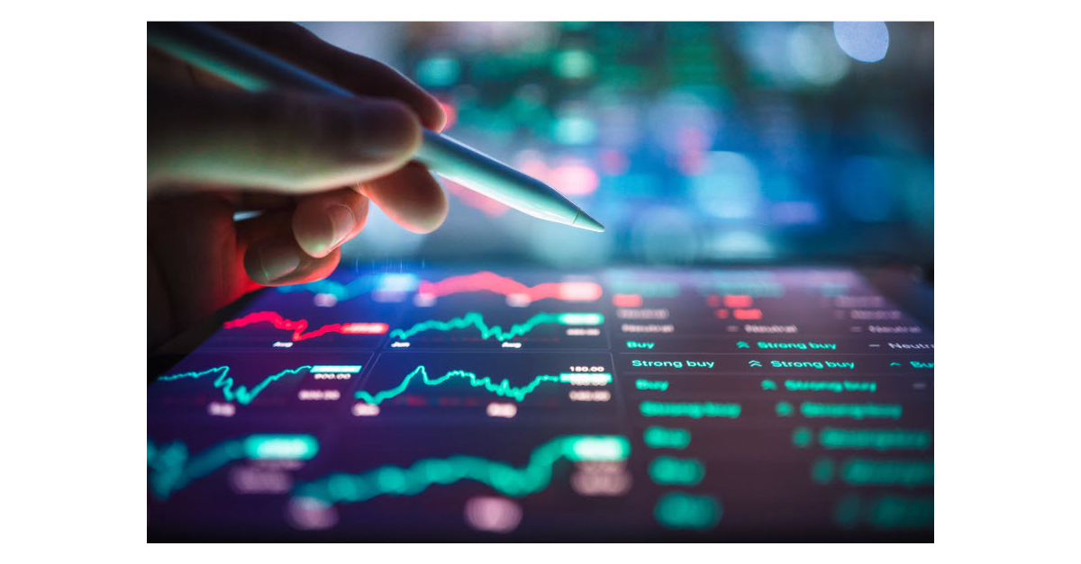 Hand analyzing stock market data