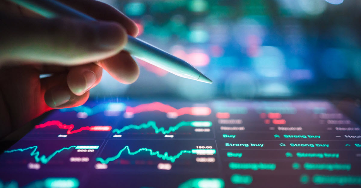Hand analyzing stock market data