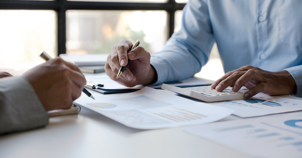 Image of two people meeting about finances