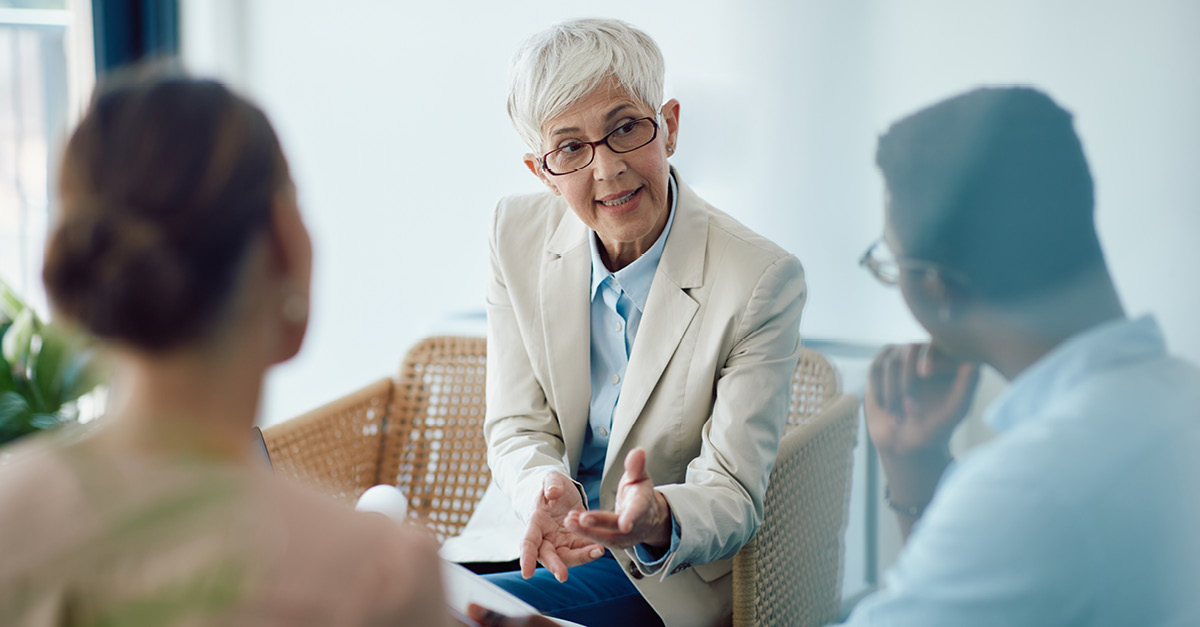 Advisor consulting with couple