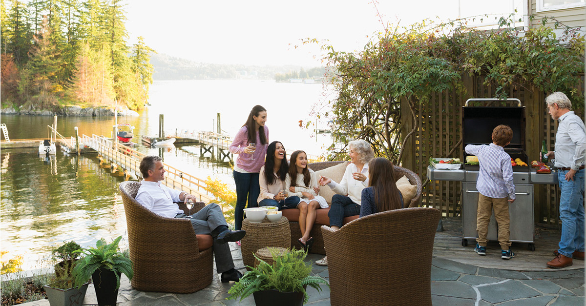 family gathering to eat along lakeside patio