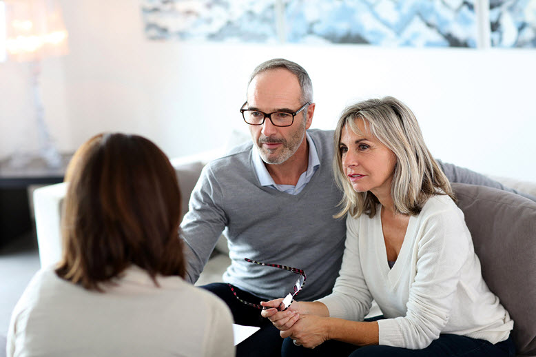 Couple meeting with their financial advisor