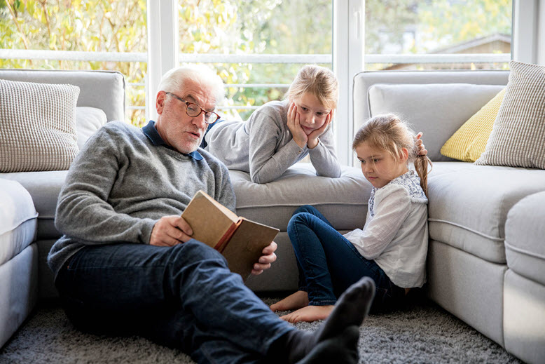 Grandpa reading to grandkids