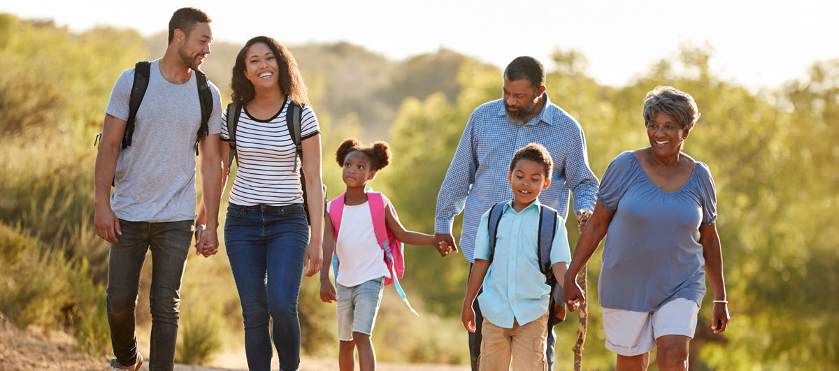 Multi-generational family walking on waterfront