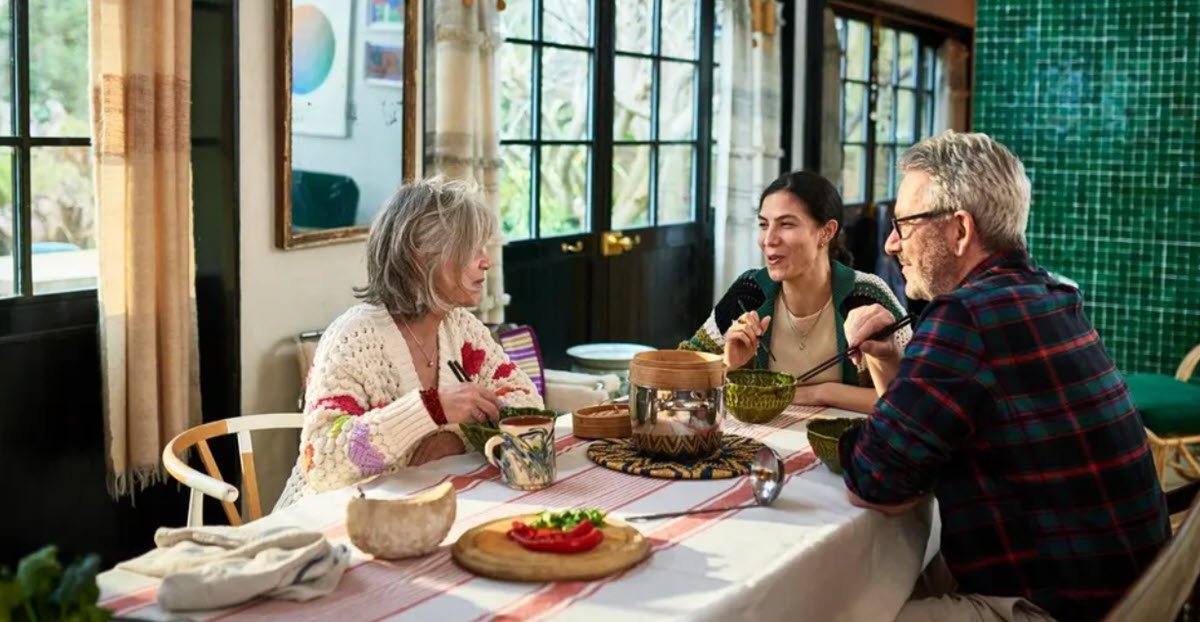 Older family talking over lunch at home